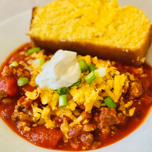 Sweet Potato and Shredded Lamb Smoky Chili with side of Cornbread topped with Cheddar (Gluten Free)