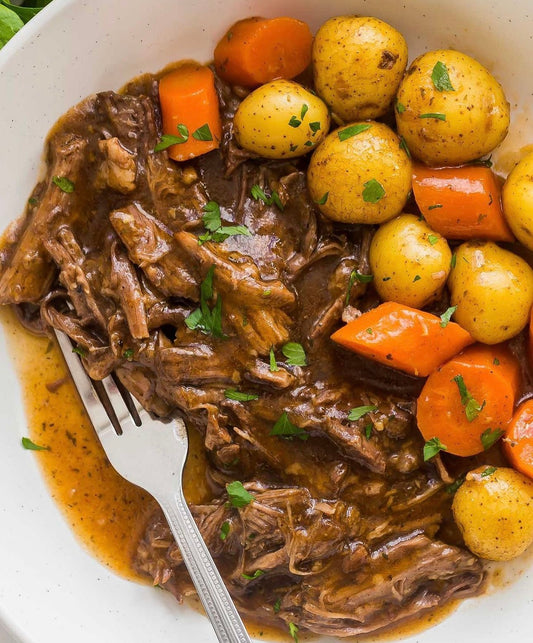 Classic Slow Cooked Braised Beef Pot Roast with Root Vegetables and Brown Gravy