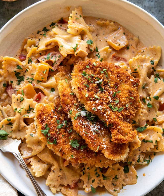 Kentucky Style Breaded Chicken over Cajun Farfalle Pasta Alfredo (Contains Gluten)